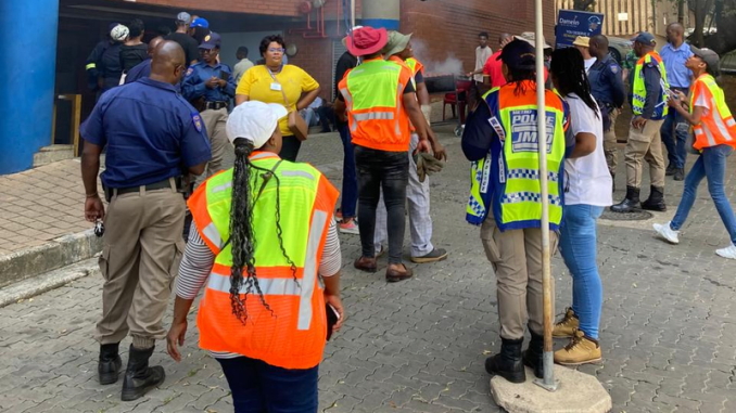 City Power officials outside Damelin College in Braamfontein to cut off electricity after the college fell into R2.9 million arrears.